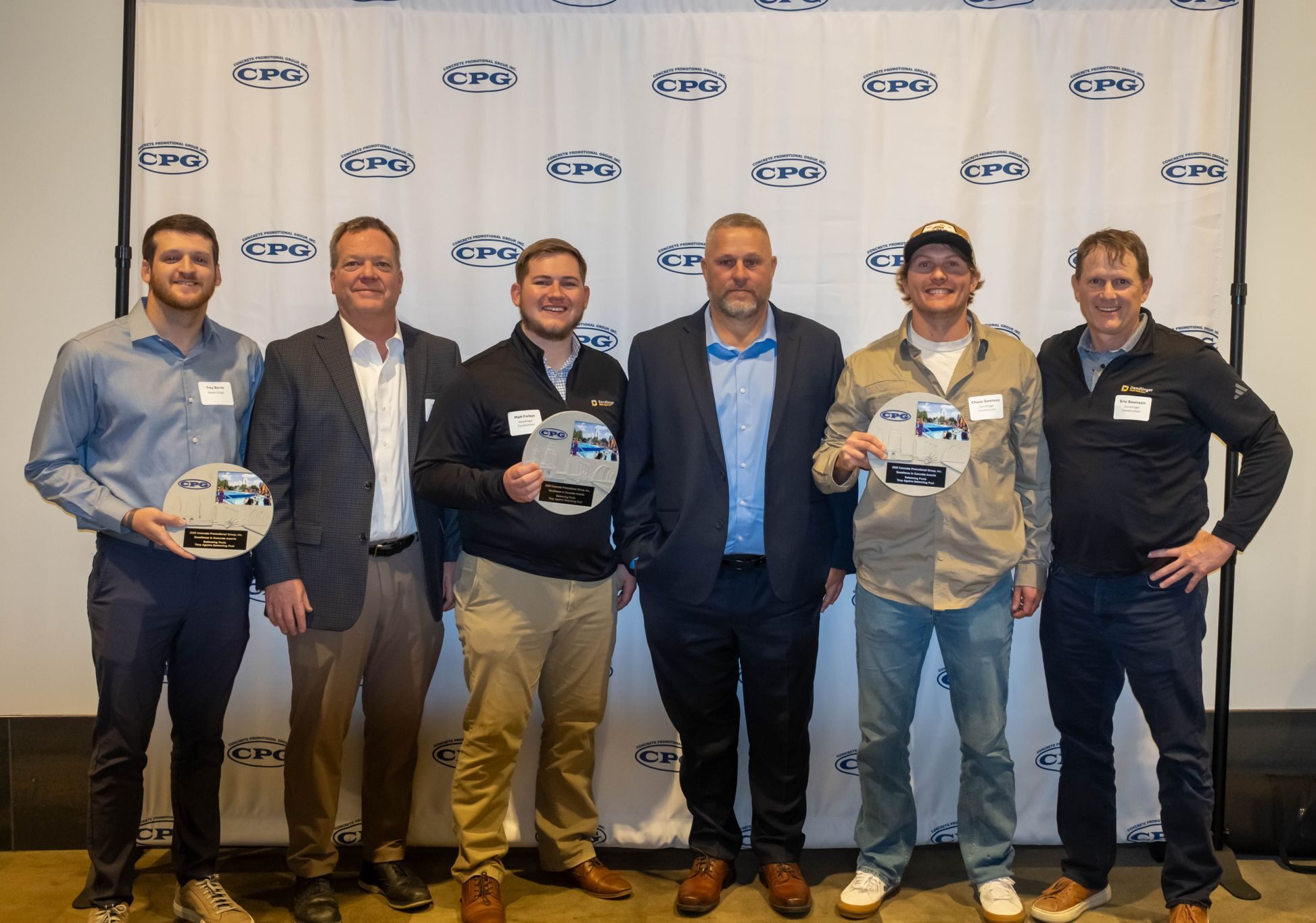 Trey Byrne, Jeff Bartley, and the project team accept CPG's Excellence in Concrete Award.